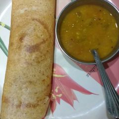 A picture of Plain dosa with sambar.