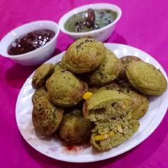 Palak corn rava appe with peanut coriander chutney A picture of Palak corn rava appe with peanut coriander chutney.