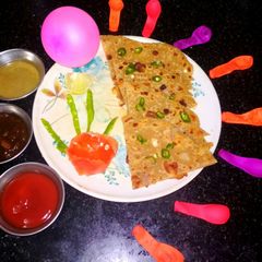 A picture of Poppy seeds and dessicated coconut paratha.