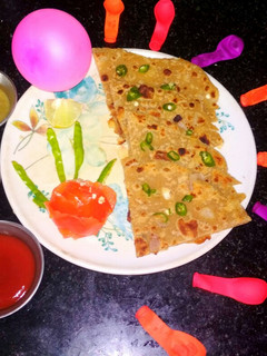 A picture of Poppy seeds and dessicated coconut paratha.