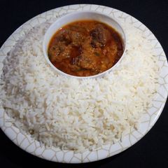 A picture of White rice with stew.