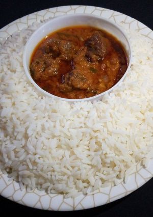 A picture of White rice with stew.