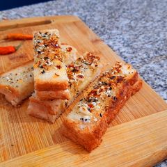A picture of Cheesy-sesame bread sticks.
