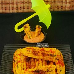 A picture of Butter Garlicky Spicy Grilled Crispy Curly Corn Ribs - With Schezwan Dip Corn Ribs Monsoon Munching.