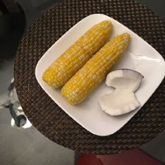 A picture of Boiled Yellow corn with coconut.