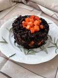 Riso venere con salsiccia e zucca