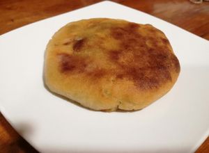Una foto de Tortilla de papa con chicharrones
