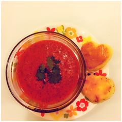 A picture of Tomato Coriander Soup with heart shaped fruit Scones.