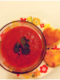 A picture of Tomato Coriander Soup with heart shaped fruit Scones.