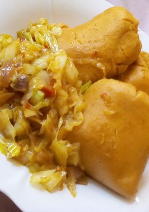 A picture of Moi moi and cabbage sauce.