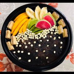 A picture of Chocolate Cake with seasonal fruits.