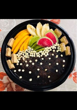 A picture of Chocolate Cake with seasonal fruits.