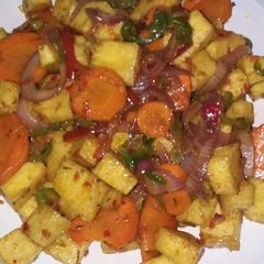 A picture of Fried yam with Veggies.