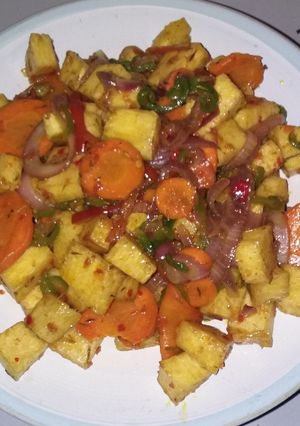 A picture of Fried yam with Veggies.