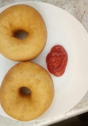 A picture of Almond doughnuts served with ketchup.
