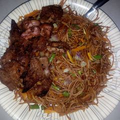 A picture of Fried vegetables brown spaghetti.