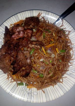 A picture of Fried vegetables brown spaghetti.