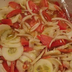 A picture of Tomato, cucumber and onion salad.