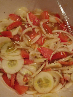 A picture of Tomato, cucumber and onion salad.