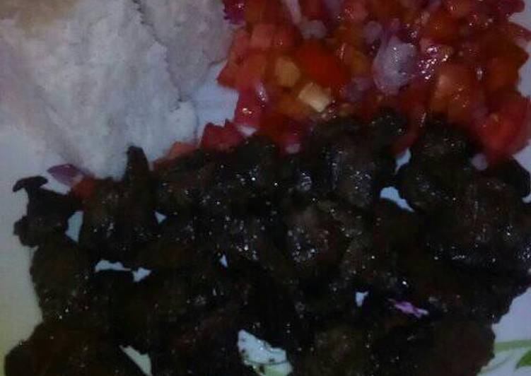 Fried liver with ugali and kachumbari