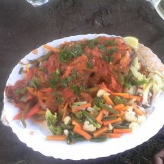 A picture of Wet fry fish with vegetables.