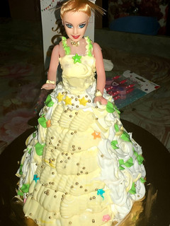 A picture of Eggless Doll cake pineappple flavour.