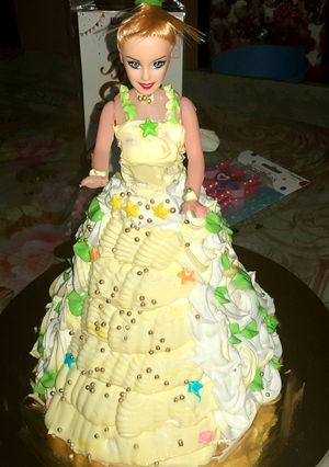 A picture of Eggless Doll cake pineappple flavour.