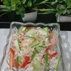 A picture of Quinoa, cucumber salad with curd.