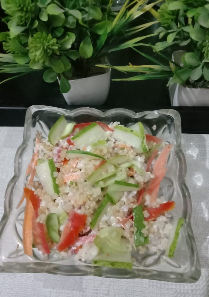 A picture of Quinoa, cucumber salad with curd.
