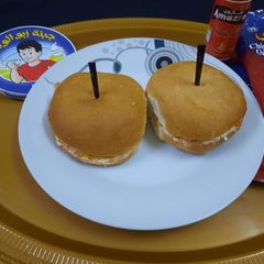 A picture of Spicy cheez,hot sauce, chips 🍟 Burger 🍔.