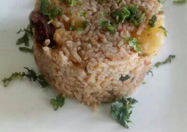 Goat pilau with potatoes and coconut