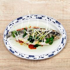 Steamed white fish with ginger, spring onion and soy sauce A picture of Steamed white fish with ginger, spring onion and soy sauce.