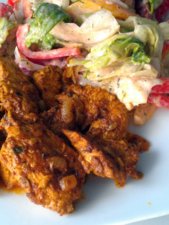 A picture of Curry chicken with onion sauce.