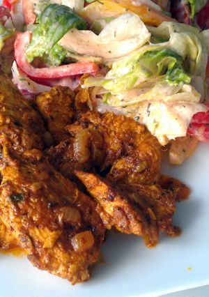A picture of Curry chicken with onion sauce.
