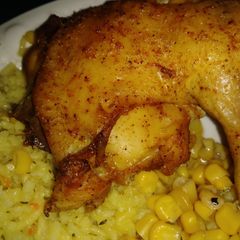 A picture of Baked chicken with broccoli rice and cprn.