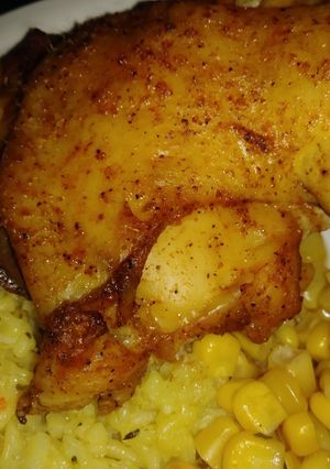 A picture of Baked chicken with broccoli rice and cprn.