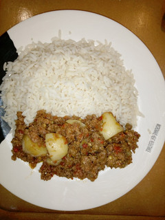 A picture of Cardamon rice with potato sauce.