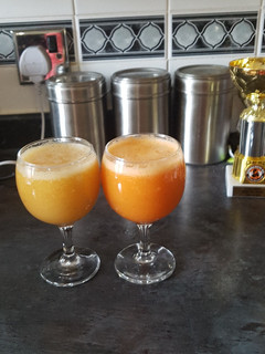 A picture of Mango,strawberries drink and Carrot, apples drink with ginger.