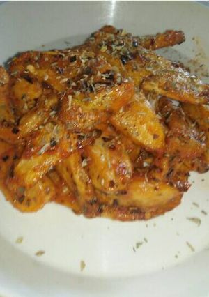 A picture of Potato Wedges in Cajun and Pasta sauce.