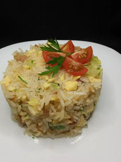 Una foto de Timbal de arroz con calabacín tortilla y panceta Ibérica