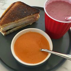 A picture of Hung curd sandwich with juice.