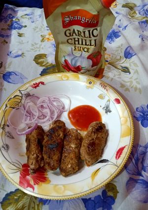 A picture of Beef seekh kabab in pan.