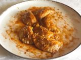 Ravioli di taro agli agrumi con gamberoni e bisque