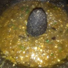 A picture of Charred Green Salsa Molcajeteada.