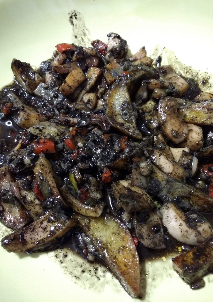 Una foto de Calamares en su tinta