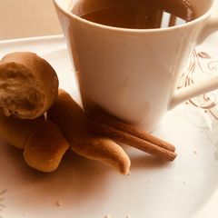 A picture of Cinnamon tea with homemade bread.