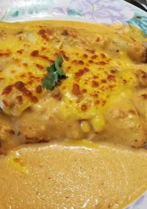 A picture of Chicken and Mushroom Crepes with Roasted Red Pepper Sauce.