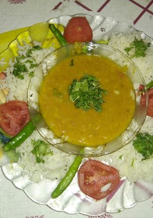 A picture of Dhaba style dal tadka with rice.
