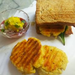 A picture of Aloo tikki veggies sandwich.