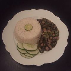 A picture of Local rice with vegetable soup.